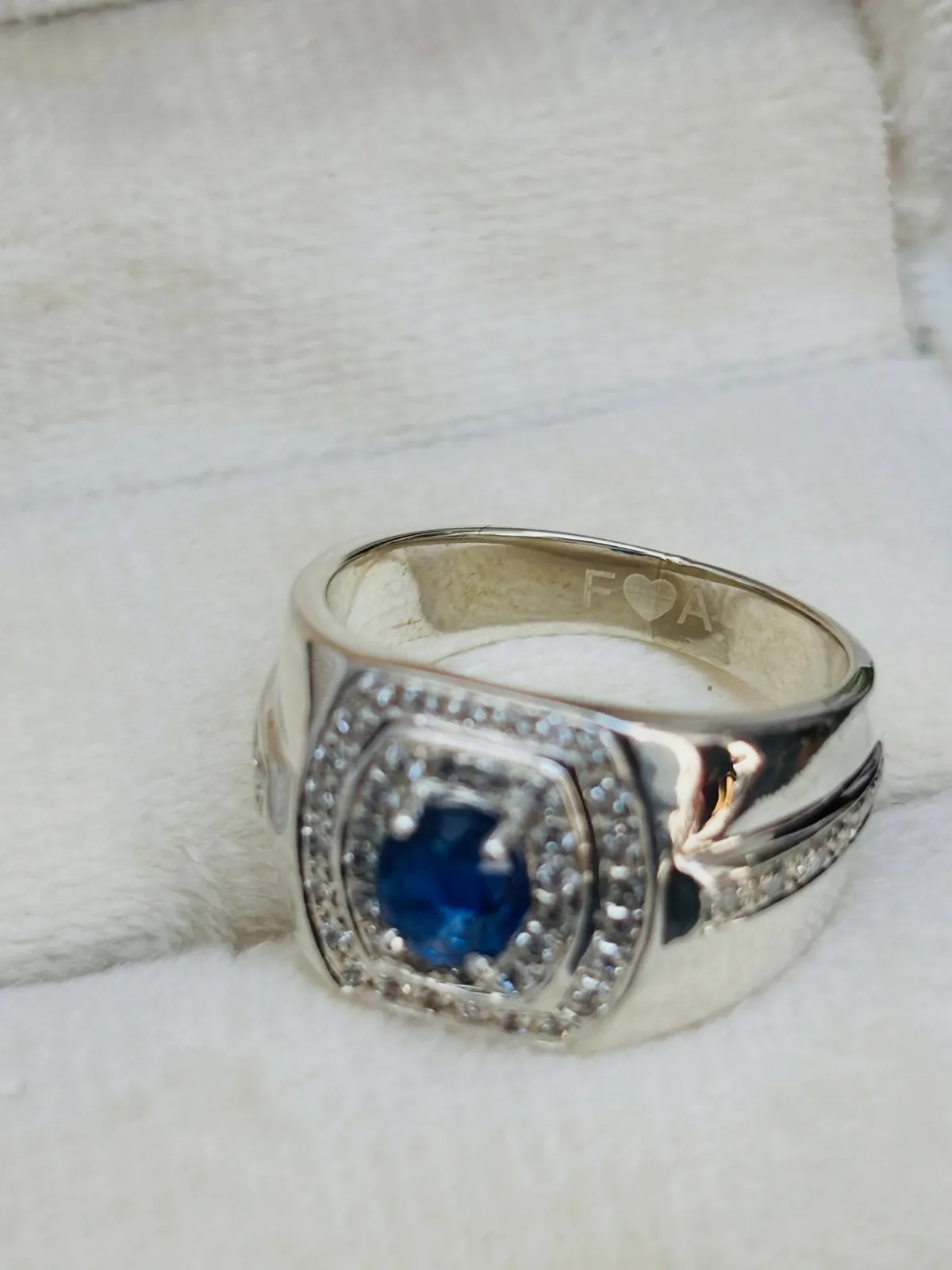 Blue sapphire silver ring with a halo