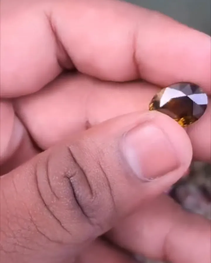 Natural chrysoberyl, brownish yellow in daylight
