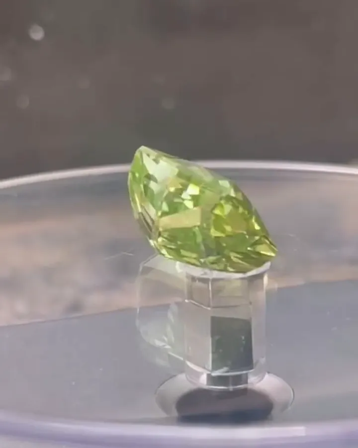Green tourmaline on a stand