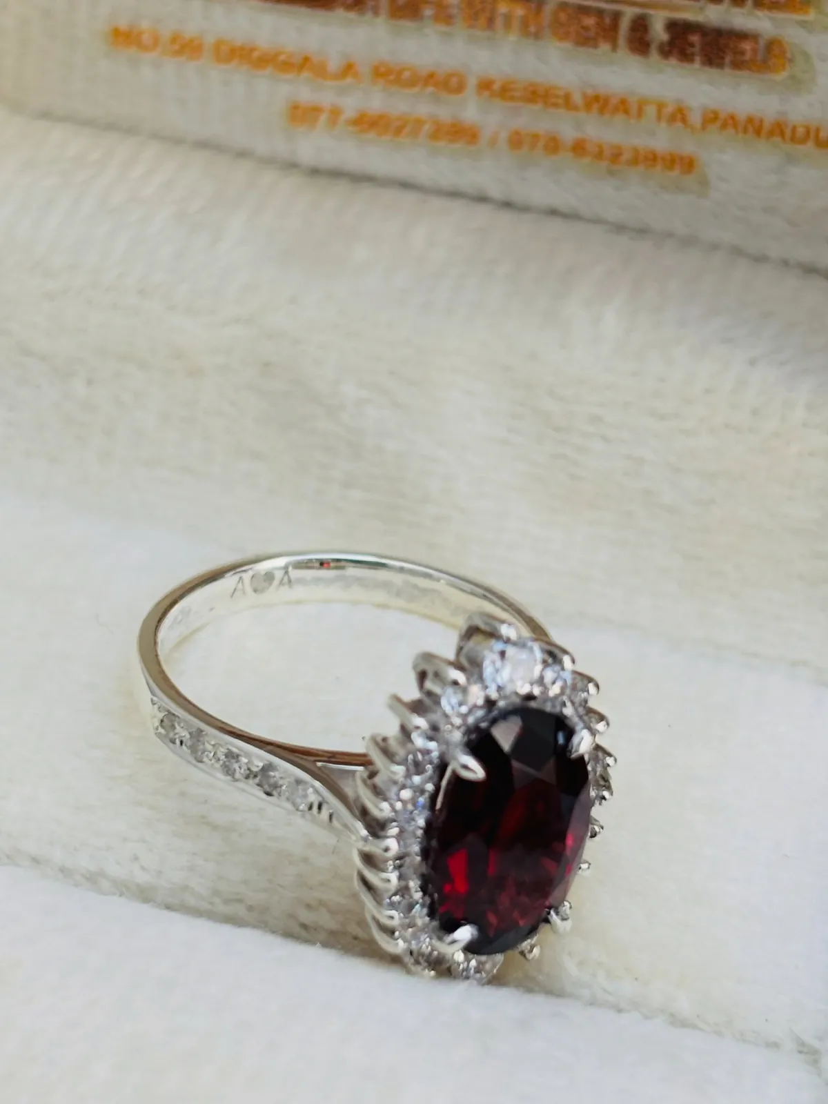 Garnet halo ring in silver