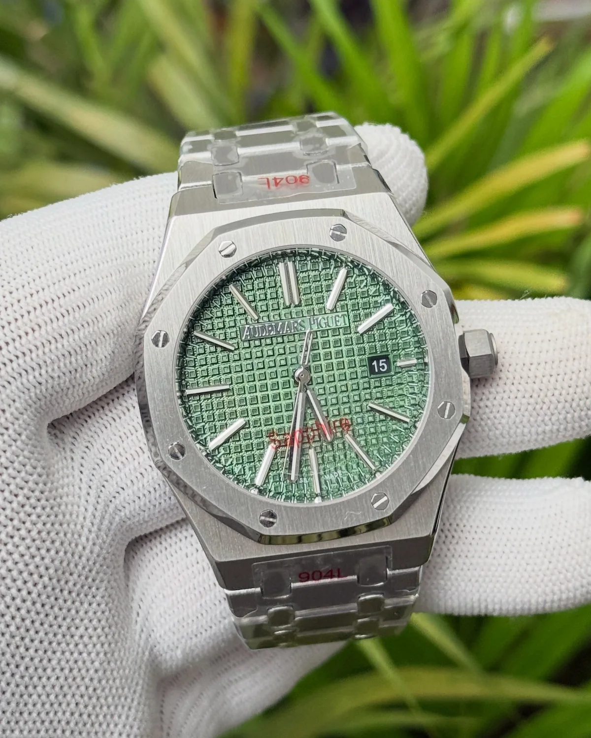Green-dial watch with an octagonal bezel, photographed by Ocean Gem & Jewel