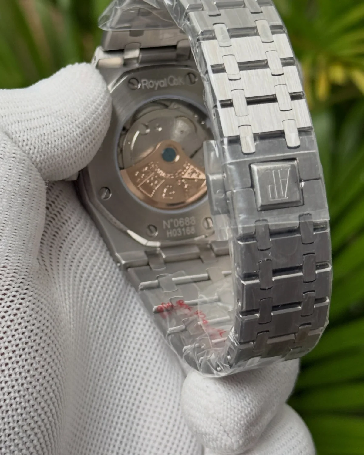 Back of the grey-dial watch, showing an exhibition caseback